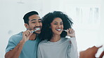 Happy couple, brushing teeth and mirror in morning routine, dental hygiene or care in bathroom at home. Interracial man and woman cleaning mouth, oral or gums in happiness or tooth whitening together