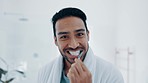 Face, man and brushing teeth in bathroom for dental wellness, morning routine and healthy gums. Portrait of happy asian guy cleaning mouth with toothbrush, toothpaste and care of fresh breath at home