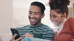 Happy couple on sofa with phone, laughing at social media meme or funny internet video in home together. Relax, man and woman on couch with smartphone, checking comic online post or joke on website.