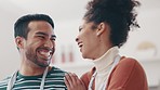 Happy couple, cooking and laughing at joke together in secret conversation, love and smile. Funny whisper, man and woman in kitchen in discussion, comedy and bonding with food and dinner time in home