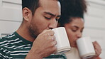 Morning, coffee and couple drink in kitchen together to relax with conversation, communication or bonding with beverage. Drinking, tea or people with hot chocolate in home on weekend or holiday