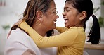 Face, nose and a grandma laughing with her grandchild in the living room of a home during a family visit. Smile, children  and a happy senior woman with her granddaughter looking funny in a house