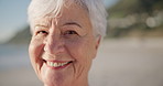 Face, smile and senior woman on beach, sunset or laughing in nature on holiday, vacation or happy trip in retirement. Elderly lady, portrait and relax in Florida summer, travel or happiness in sun