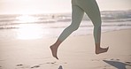 Legs, running and fitness on beach, woman with cardio and health, travel and wellness outdoor at sunrise. Exercise, active in nature and training, marathon or race with sea, fresh air and barefoot