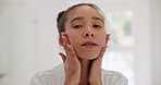 Skincare, beauty and hands on face of woman in a bathroom with glowing skin, treatment and results at home. Portrait, dermatology and female touching smooth, soft and collagen cosmetic satisfaction