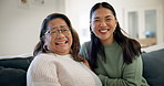 Love, happy and mother with child on sofa in living room, family and smile on couch in lounge of apartment for care. Laugh, japanese woman and kid having fun together and relaxing in house or home 