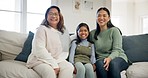 Child, mother and grandma laughing in a family home with happiness, love and support. Girl kid, asian woman and parent relax together for adoption of daughter with joy in living room for visit

