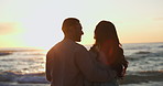 Love, sunset and silhouette of couple at beach for relax, summer vacation and travel. Happy, adventure and wellness with man and woman on seaside date for holiday, marriage and peace together