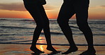 Sunset, dancing and couple on a beach for holiday or tropical vacation together for love or care on island. Silhouette, man and woman with happiness on anniversary with travel freedom at ocean