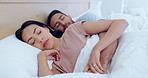 Sleeping, bed and couple rest together in a bedroom to relax for romance or care in the morning in a home. Love, tired and calm people cuddle in relationship dreaming during nap on a weekend