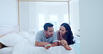 Happy couple, bed and pregnancy test in good news, positive or celebration in happiness, family or home. Excited man and woman smile lying in bedroom in maternity, parents or growth together in house