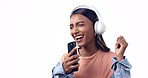 Woman, headphones and phone in studio, singing and listening to music, sound and happy by white background. Girl dancer, smartphone and excited for audio streaming, karaoke and performance with app