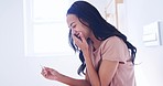 Smile, excited and woman with positive pregnancy test in the bathroom of her modern apartment. Happy, maternity and young pregnant female person with fertility stick device for ivf result at home.