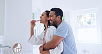 Bathroom hug, love and happy couple brushing teeth for morning routine, tooth cleaning or self care. Home embrace, smile and man hugging woman grooming for oral hygiene, dental or beauty treatment