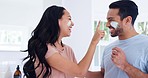 Skincare, cream and playful couple in bathroom, fun and morning cleaning for facial wellness. Beauty, dermatology and cosmetics, happy man and woman with lotion for on face for treatment in home.