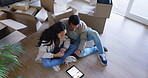 Happy couple, tablet and boxes in new home, renovation or interior planning together on floor above. Top view of man and woman on technology for moving in, house or check online furniture on property