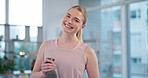 Exercise, face and woman smile in living room with water bottle for yoga, workout or holistic fitness at home. Happy, portrait and female athlete relax after training, pilates or meditation routine