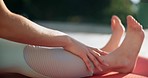 Woman, hands and legs in yoga, stretching or fitness in zen workout, exercise or spiritual wellness in nature. Closeup of female person or yogi in body warm up, pilates or outdoor meditation on mat