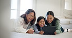 Laughing, tablet and happy kid, mom and grandma watch comedy film, social network meme and cartoon movie. Funny, and family child, mother and grandmother relax on floor, home lounge and reading comic