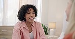 Happy, lesbian couple and conversation in home, bonding and having fun together. Smile, gay women and interracial girls in communication for healthy relationship, connection and care of lgbtq partner