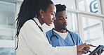 Meeting, tablet and a doctor in discussion with a nurse in the hospital about healthcare diagnosis. Medicine, teamwork or planning with a medical professional and assistant in a clinic for treatment