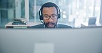 Computer, customer service and support with a black man consultant working in a call center for assistance. Contact, communication and headset with an employee consulting in a telemarketing office