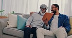 Smile, family and father with son, tablet and conversation with website information, internet or social media. Home, dad or black men on a couch, tech or funny with network, discussion or connection