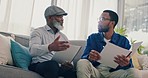 Home, father and son with paperwork, discussion and talking with pension fund, planning and insurance. Family, black men and dad with adult on a couch and documents for retirement and conversation