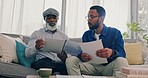 Home, father and son with paperwork, reading and conversation with planning for pension fund, property and retirement. Family, black men or financial broker on a couch and documents for insurance