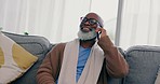 Smile, phone call and senior man on a couch, conversation or connection with discussion, relax or network. African person, home or pensioner with a smartphone, communication or retirement in a lounge