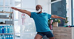 Exercise, yoga and rehabilitation with a senior black man in a physiotherapy office for training or wellness. Fitness, workout and recovery with an elderly patient in a clinic for physical therapy