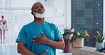 Exercise, yoga and breathing with a senior black man in a physiotherapy office for training or mental wellness. Fitness, workout and inhale with an elderly patient in a clinic for physical therapy