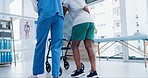 Senior care, support and physiotherapist with old man, walker and healthcare from back. Rehabilitation coach, physio or caregiver with elderly patient walking in mobility training clinic in Africa.