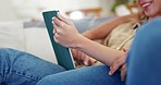 Couple, hands and relax with tablet in home for online shopping, streaming multimedia and search internet. Closeup, people and scroll on digital technology, social media app or subscription on sofa