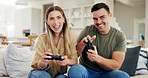 Gaming, play or excited couple with video game in arcade competition on website online at home. Smile, fun gamers or happy people streaming on digital technology to relax on house living room couch 