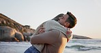 Couple hug, beach and freedom with adventure and love together on romantic date at sunset. Travel, woman running into man arms and energy, embrace and trust with support and care outdoor in nature