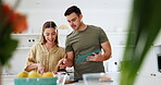 Tablet, instructions and a couple cooking food in their kitchen together for health, wellness or nutrition. Technology, diet or recipe with a man and woman in their house to prepare a meal for supper