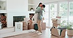 Couple, hug and celebrate new house with a smile, love pr excited about moving in together. Security, support and interracial man and woman with mortgage, rent or loan for real estate with boxes