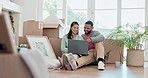 Happy couple, boxes and laptop in new home, property or investment together on living room floor. Excited man or woman smile, thinking or idea in house renovation, relocation or real estate apartment