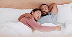 Happy couple, bed and relax in morning sleep, holiday weekend or break together on pillow at home. Man and woman enjoying hug and lying in bedroom, comfort or love in nap, rest or asleep at house