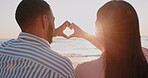 Couple, heart and hands at beach in sun, sky or love on romantic holiday, vacation or summer flare. Closeup, man and woman with finger for support, freedom or emoji sign at sunset ocean from the back