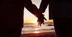 Closeup, holding hands and silhouette with couple at beach for travel, summer vacation and sunset. Relax, support and holiday with man and woman on seaside date for commitment, love and care together