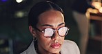 Night, reading and a woman with a computer in an office for an email, research or working on a project. Dark, serious and a corporate employee with glasses and knowledge on a pc for a deadline