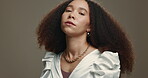 Face, hair and natural with an afro woman in studio on a gray background for salon treatment. Portrait, spa and beauty with a confident young female model at the hairdresser for haircare or hairstyle