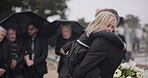 Sad, hug and a father and child at a funeral with depression and mourning at the graveyard. Holding, young and a dad with care and love for a girl kid at a cemetery burial and grieving together