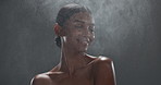 Beauty, mockup and perfume with an indian woman in studio on a gray background for fresh fragrance. Luxury, wellness and smile with a young model spraying a product on her skin for cosmetic parfum