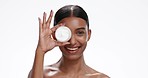 Face of Indian woman with cream container for skincare, wellness and facial cosmetics on white background. Dermatology, beauty and isolated portrait of person for makeup, lotion or products in studio