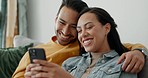 Couple, smile and talking on sofa with phone for social media post, subscription and reading funny notification. Happy man, woman and hug with smartphone for meme, games app and relax in living room