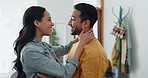 Couple, happy and hug in home lounge with a smile, security and love in healthy relationship. Young man and woman together in an apartment for affection, forehead touch and communication with care