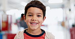 Face, education and a student boy at a science fair for learning, growth or child development. Portrait, smile and future with a happy young male kid at a school closeup for research or experiment